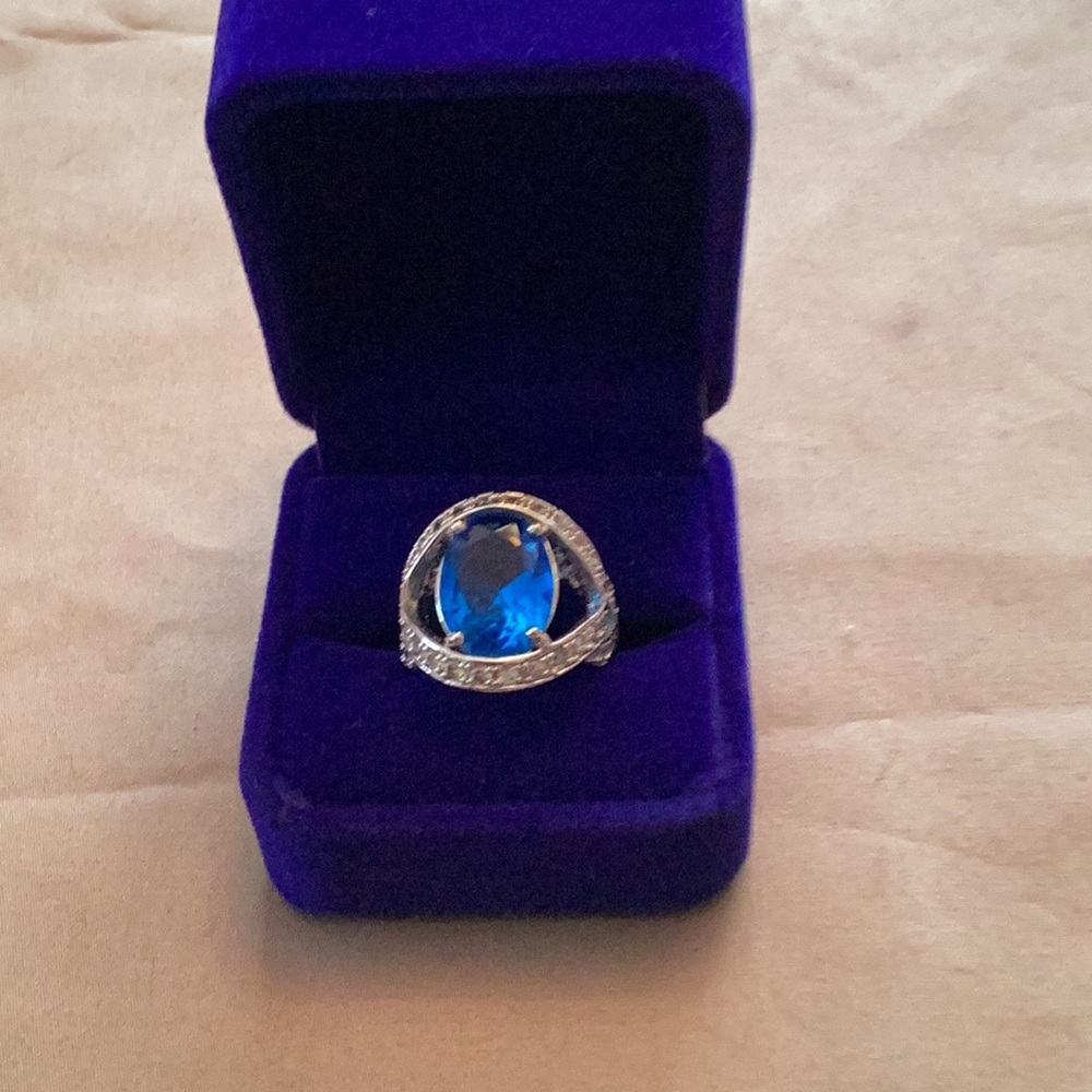 .925 sterling silver& sparkling blue ring, size 6.5.  Setting is GORGEOUS!